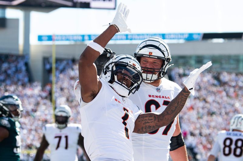 Cincinnati Bengals wide receiver Ja'Marr Chase (1) celebrates a touchdown in the first half during an NFL football game against the Philadelphia Eagles on Sunday, Oct. 27, 2024, in Cincinnati. (AP Photo/Emilee Chinn)