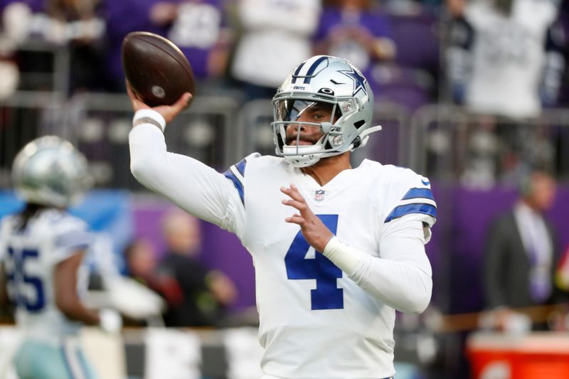 Dallas Cowboys quarterback Dak Prescott warms up before an NFL football game against the Minnesota Vikings, Sunday, Nov. 20, 2022, in Minneapolis. (AP Photo/Bruce Kluckhohn)