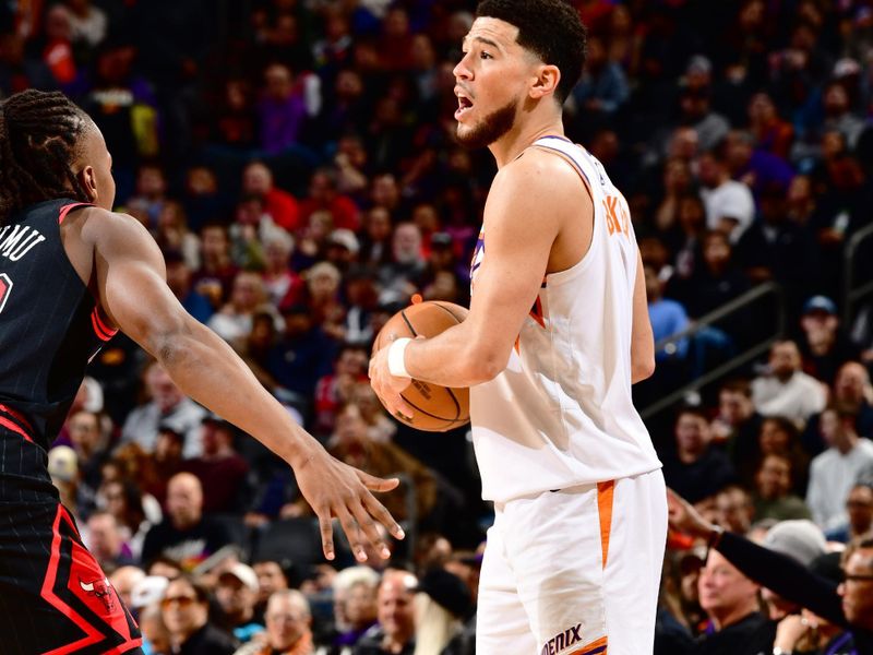 PHOENIX, AZ - JANUARY 22:  Devin Booker #1 of the Phoenix Suns looks to pass the ball during the game against the Chicago Bulls on January 22, 2024 at Footprint Center in Phoenix, Arizona. NOTE TO USER: User expressly acknowledges and agrees that, by downloading and or using this photograph, user is consenting to the terms and conditions of the Getty Images License Agreement. Mandatory Copyright Notice: Copyright 2024 NBAE (Photo by Barry Gossage/NBAE via Getty Images)