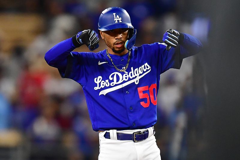 Jul 6, 2023; Los Angeles, California, USA; Los Angeles Dodgers second baseman Mookie Betts (50) reaches second against the Pittsburgh Pirates during the seventh inning at Dodger Stadium. Mandatory Credit: Gary A. Vasquez-USA TODAY Sports