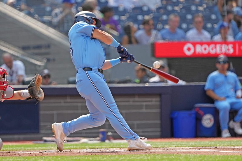 Sep 4, 2024; Toronto, Ontario, CAN; Toronto Blue Jays center fielder Daulton Varsho (25) hits a double against the Philadelphia Phillies during the first inning at Rogers Centre. Mandatory Credit: Nick Turchiaro-Imagn Images