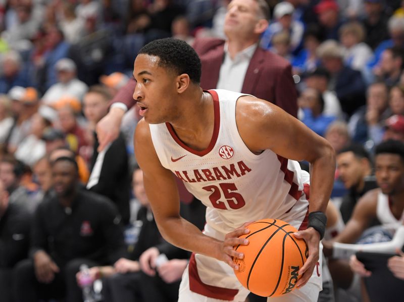 Mar 10, 2023; Nashville, TN, USA;  Alabama Crimson Tide Nimari Burnett (25) holds the ball against the Mississippi State Bulldogs during the  second half at Bridgestone Arena. Mandatory Credit: Steve Roberts-USA TODAY Sports