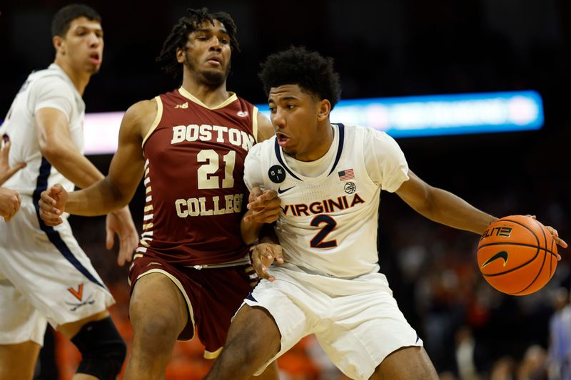 Jan 28, 2023; Charlottesville, Virginia, USA; Virginia Cavaliers guard Reece Beekman (2) dribbles the ball as Boston College Eagles forward Devin McGlockton (21) defends in the second half  at John Paul Jones Arena. Mandatory Credit: Geoff Burke-USA TODAY Sports