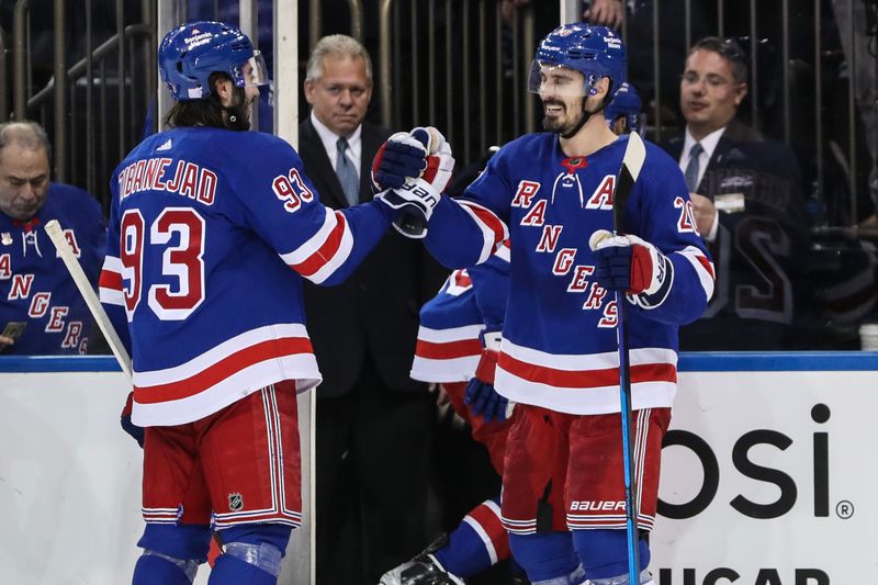 Nov 1, 2022; New York, New York, USA;  New York Rangers left wing Chris Kreider (20) celebrates with center Mika Zibanejad (93) after scoring the game winning goal against the Philadelphia Flyers at Madison Square Garden. Mandatory Credit: Wendell Cruz-USA TODAY Sports