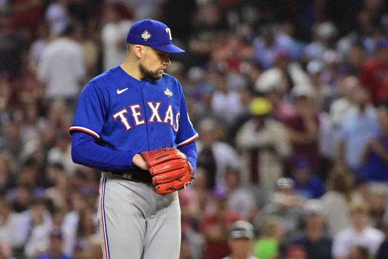 Nov 1, 2023; Phoenix, AZ, USA; Texas Rangers starting pitcher Nathan Eovaldi (17) pitches in the fourth inning against the Arizona Diamondbacks in game five of the 2023 World Series at Chase Field. Mandatory Credit: Matt Kartozian-USA TODAY Sports