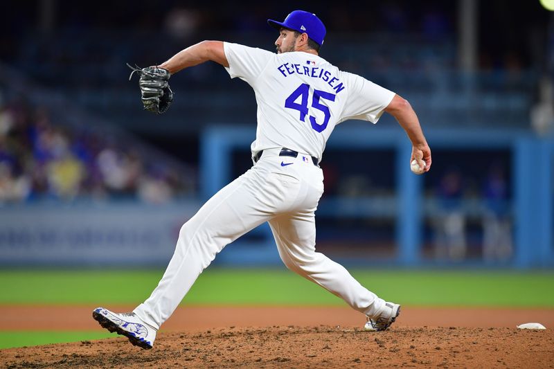 May 4, 2024; Los Angeles, California, USA; Los Angeles Dodgers pitcher J.P. Feyereisen (45) throws against the Atlanta Braves during the ninth inning at Dodger Stadium. Mandatory Credit: Gary A. Vasquez-USA TODAY Sports