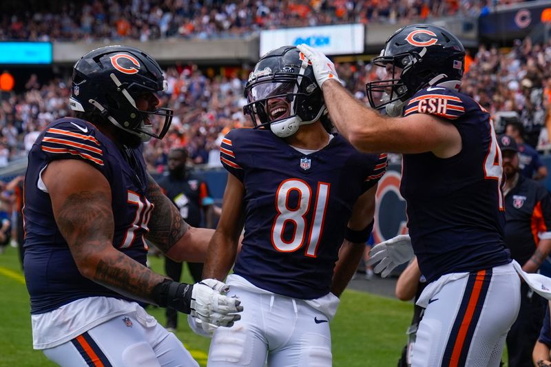 Chicago Bears wide receiver Dante Pettis (81) celebrating his touchdown with tight end Tommy Sweeney (47) and guard Matt Pryor (79) during the second half of an NFL preseason football game against Cincinnati Bengals, Saturday, Aug. 17, 2024, at Soldier Field in Chicago. (AP Photo/Erin Hooley)