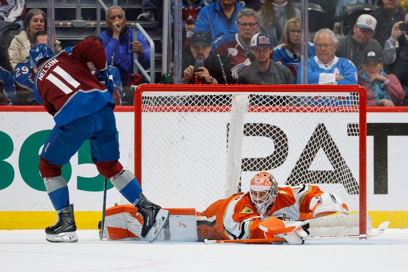 Jan 21, 2026; Denver, Colorado, USA; Anaheim Ducks goaltender Lukas Dostal (1) makes a save against Colorado Avalanche center Brock Nelson (11) in the shootout at Ball Arena. Mandatory Credit: Isaiah J. Downing-Imagn Images