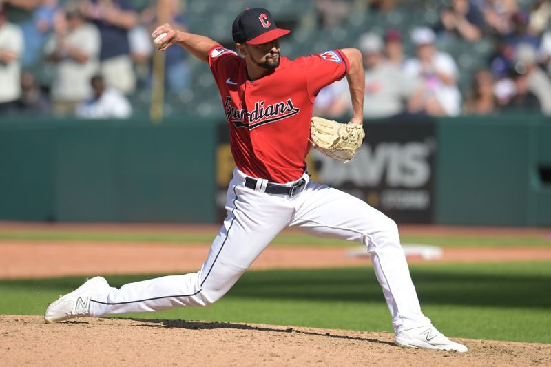 Sep 17, 2023; Cleveland, Ohio, USA; Cleveland Guardians relief pitcher Nick Sandlin (52) throws a pitch during the ninth inning against the Texas Rangers at Progressive Field. Mandatory Credit: Ken Blaze-USA TODAY Sports