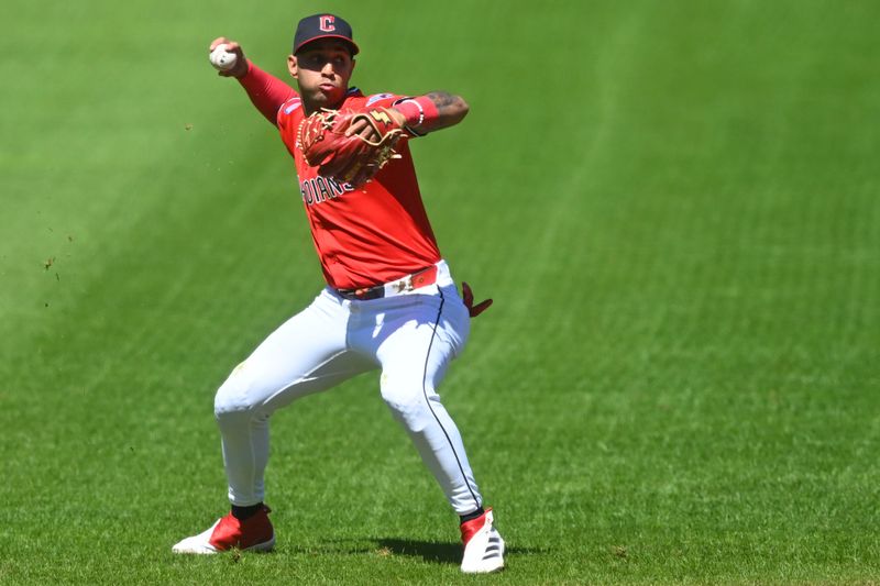 Aug 31, 2025; Cleveland, Ohio, USA; Cleveland Guardians shortstop Brayan Rocchio (4) throws to first base in the second inning against the Seattle Mariners at Progressive Field. Mandatory Credit: David Richard-Imagn Images
