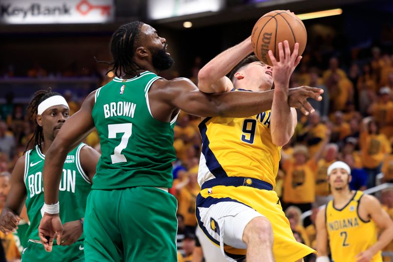 INDIANAPOLIS, INDIANA - MAY 27: Jaylen Brown #7 of the Boston Celtics fouls T.J. McConnell #9 of the Indiana Pacers during the fourth quarter in Game Four of the Eastern Conference Finals at Gainbridge Fieldhouse on May 27, 2024 in Indianapolis, Indiana. NOTE TO USER: User expressly acknowledges and agrees that, by downloading and or using this photograph, User is consenting to the terms and conditions of the Getty Images License Agreement. (Photo by Justin Casterline/Getty Images)