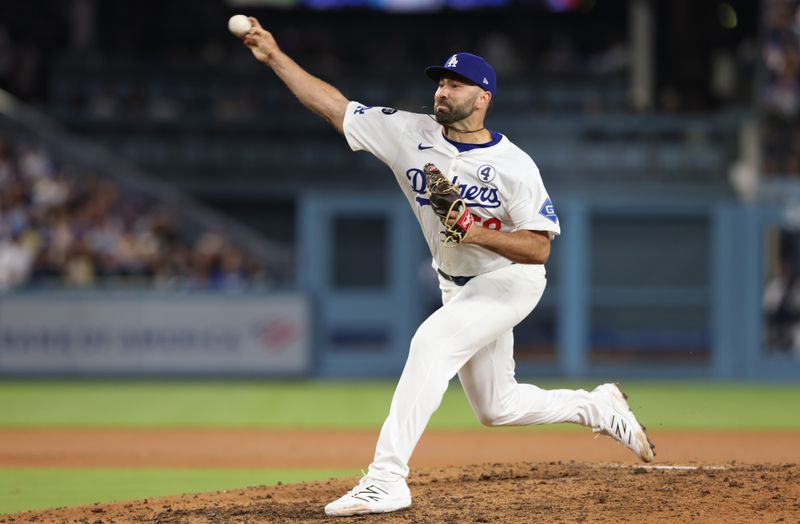 Jun 2, 2025; Los Angeles, California, USA; Los Angeles Dodgers pitcher Lou Trivino (58) throws during the ninth inning against the New York Mets at Dodger Stadium. Mandatory Credit: Jason Parkhurst-Imagn Images