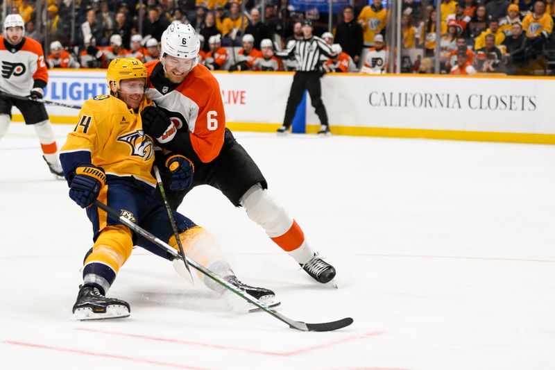 Nov 27, 2024; Nashville, Tennessee, USA;  Nashville Predators center Gustav Nyquist (14) and Philadelphia Flyers defenseman Travis Sanheim (6) battle for the puck during the first period at Bridgestone Arena. Mandatory Credit: Steve Roberts-Imagn Images