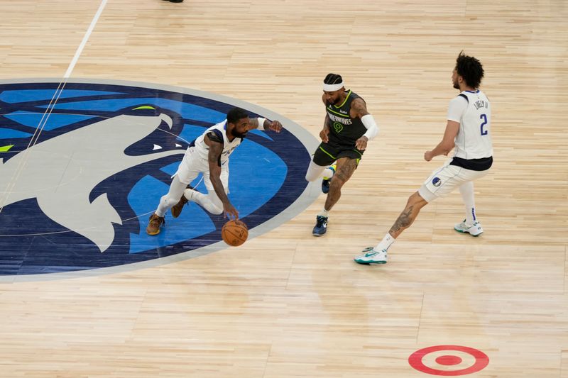 MINNEAPOLIS, MN - MAY 30: Kyrie Irving #11 of the Dallas Mavericks dribbles the ball during the game against the Minnesota Timberwolves during Game 5 of the Western Conference Finals of the 2024 NBA Playoffs on May 30, 2024 at Target Center in Minneapolis, Minnesota. NOTE TO USER: User expressly acknowledges and agrees that, by downloading and or using this Photograph, user is consenting to the terms and conditions of the Getty Images License Agreement. Mandatory Copyright Notice: Copyright 2024 NBAE (Photo by Jordan Johnson/NBAE via Getty Images)