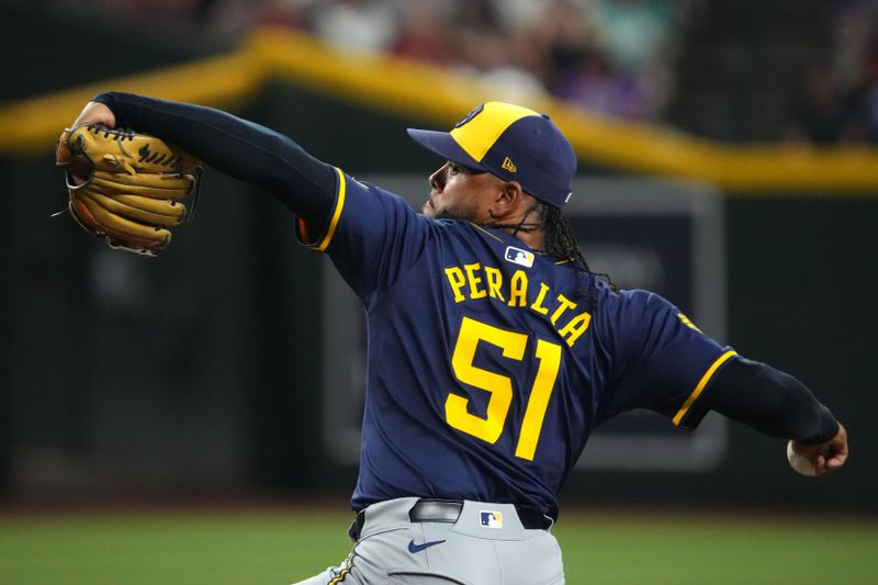 Sep 13, 2024; Phoenix, Arizona, Milwaukee Brewers pitcher Freddy Peralta (51) pitches against the Arizona Diamondbacks USA; during the first inning at Chase Field. Mandatory Credit: Joe Camporeale-Imagn Images