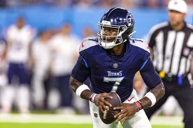 Tennessee Titans quarterback Malik Willis (7) looks for a receiver during their NFL football game against the New England Patriots Friday, Aug. 25, 2023, in Nashville, Tenn. (AP Photo/Wade Payne)