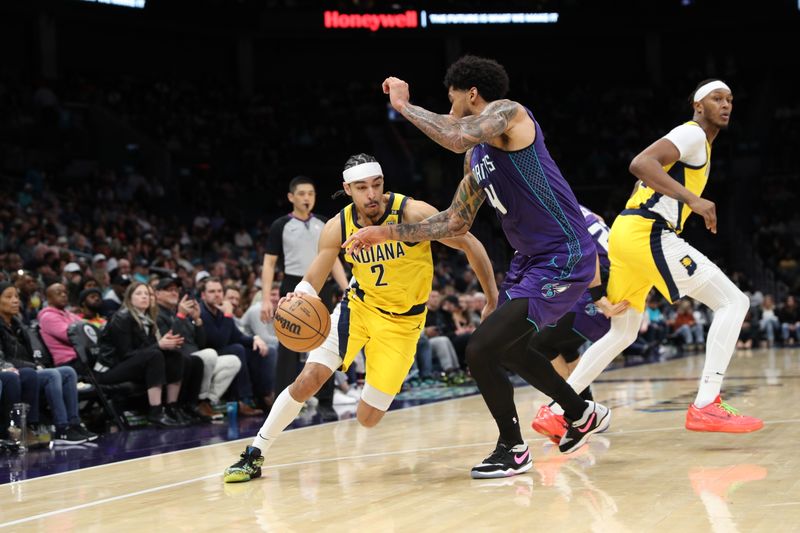 CHARLOTTE, NC - FEBRUARY 12: Andrew Nembhard #2 of the Indiana Pacers handles the ball during the game against the Charlotte Hornets on February 12, 2024 at Spectrum Center in Charlotte, North Carolina. NOTE TO USER: User expressly acknowledges and agrees that, by downloading and or using this photograph, User is consenting to the terms and conditions of the Getty Images License Agreement.  Mandatory Copyright Notice:  Copyright 2024 NBAE (Photo by Brock Williams-Smith/NBAE via Getty Images)