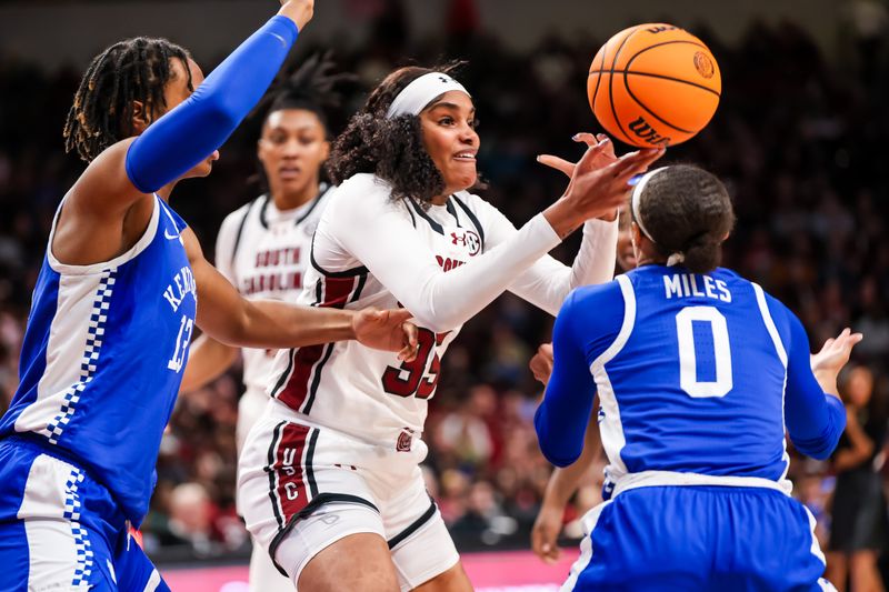 Jan 15, 2024; Columbia, South Carolina, USA; South Carolina Gamecocks center Sakima Walker (35) grabs a rebound from Kentucky Wildcats forward Ajae Petty (13) and guard Brooklynn Miles (0) in the second half at Colonial Life Arena. Mandatory Credit: Jeff Blake-USA TODAY Sports