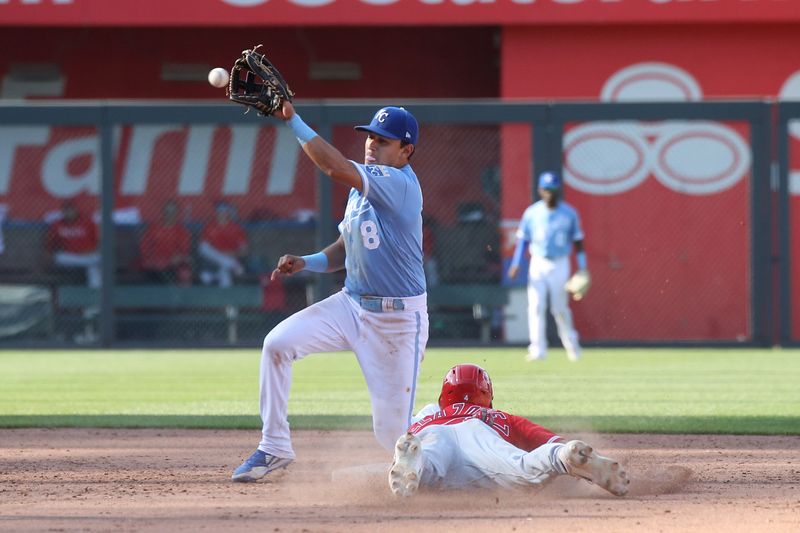 Jun 17, 2023; Kansas City, Missouri, USA; Los Angeles Angels shortstop Andrew Valezquez (4) slides safely into second base as Kansas City Royals second baseman Nicky Lopez (8) is late getting the ball during the top of the ninth inning at Kauffman Stadium. Mandatory Credit: Scott Sewell-USA TODAY Sports