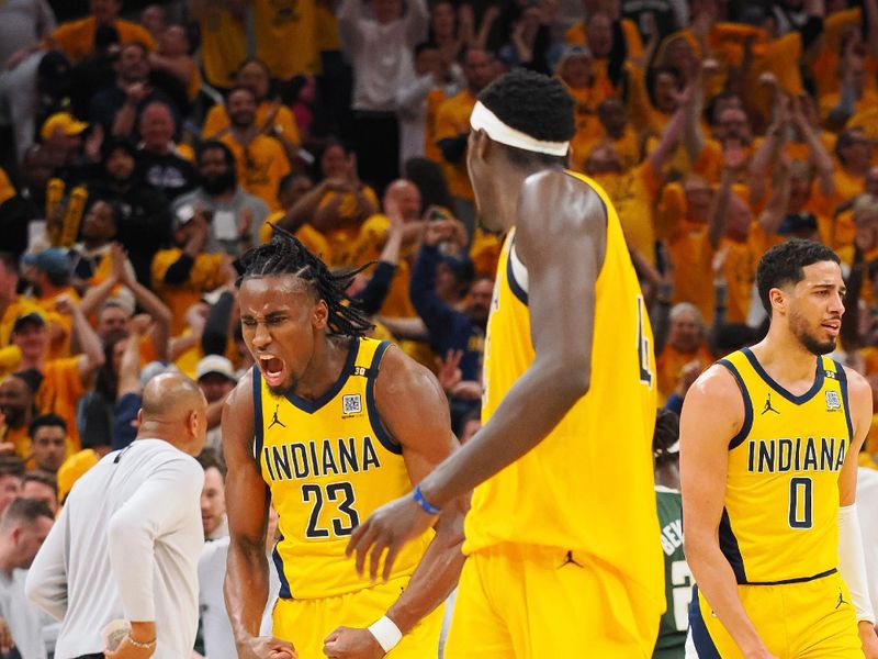 INDIANAPOLIS, IN - APRIL 26:  Aaron Nesmith #23 of the Indiana Pacers reacts after sinking a three point basket against the Milwaukee Bucks during Round 1 Game 3 of the 2024 NBA Playoffs on April 26, 2024 at Gainbridge Fieldhouse in Indianapolis, Indiana. NOTE TO USER: User expressly acknowledges and agrees that, by downloading and or using this Photograph, user is consenting to the terms and conditions of the Getty Images License Agreement. Mandatory Copyright Notice: Copyright 2024 NBAE (Photo by Ron Hoskins/NBAE via Getty Images)