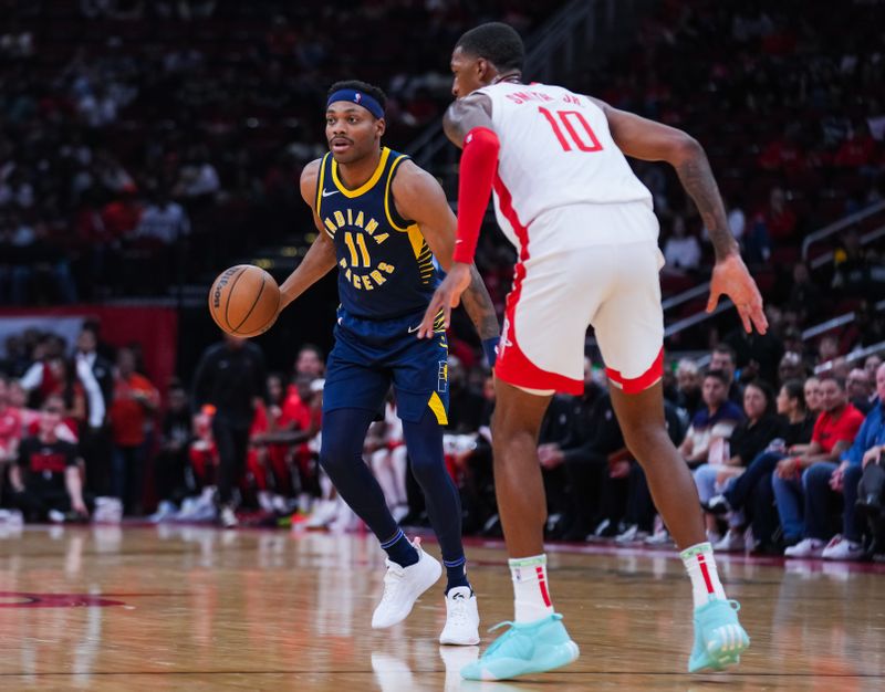 HOUSTON, TEXAS - OCTOBER 10: Bruce Brown #11 of the Indiana Pacers dribbles the ball during the preseason game against the Houston Rockets at Toyota Center on October 10, 2023 in Houston, Texas. NOTE TO USER: User expressly acknowledges and agrees that, by downloading and or using this photograph, User is consenting to the terms and conditions of the Getty Images License Agreement. (Photo by Alex Bierens de Haan/Getty Images)