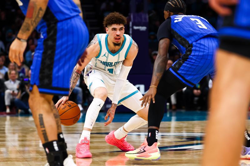 CHARLOTTE, NORTH CAROLINA - NOVEMBER 25: LaMelo Ball #1 of the Charlotte Hornets controls the ball during the second first half of a basketball game against the Orlando Magic at Spectrum Center on November 25, 2024 in Charlotte, North Carolina. NOTE TO USER: User expressly acknowledges and agrees that, by downloading and or using this photograph, User is consenting to the terms and conditions of the Getty Images License Agreement. (Photo by David Jensen/Getty Images)