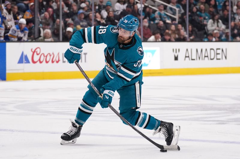 Mar 6, 2026; San Jose, California, USA; San Jose Sharks defenseman Mario Ferraro (38) takes a shot against the St. Louis Blues in the second period at SAP Center at San Jose. Mandatory Credit: David Gonzales-Imagn Images