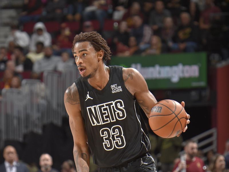 CLEVELAND, OH - NOVEMBER 9: Nicolas Claxton #33 of the Brooklyn Nets looks on during the game against the Cleveland Cavaliers on November 9, 2024 at Rocket Mortgage FieldHouse in Cleveland, Ohio. NOTE TO USER: User expressly acknowledges and agrees that, by downloading and/or using this Photograph, user is consenting to the terms and conditions of the Getty Images License Agreement. Mandatory Copyright Notice: Copyright 2024 NBAE (Photo by David Liam Kyle/NBAE via Getty Images)