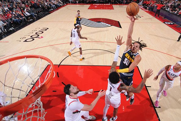 PORTLAND, OR - OCTOBER 24: Aaron Gordon #50 of the Denver Nuggets drives to the basket during the game against the Portland Trail Blazers on October 24, 2022 at the Moda Center Arena in Portland, Oregon. NOTE TO USER: User expressly acknowledges and agrees that, by downloading and or using this photograph, user is consenting to the terms and conditions of the Getty Images License Agreement. Mandatory Copyright Notice: Copyright 2022 NBAE (Photo by Sam Forencich/NBAE via Getty Images)