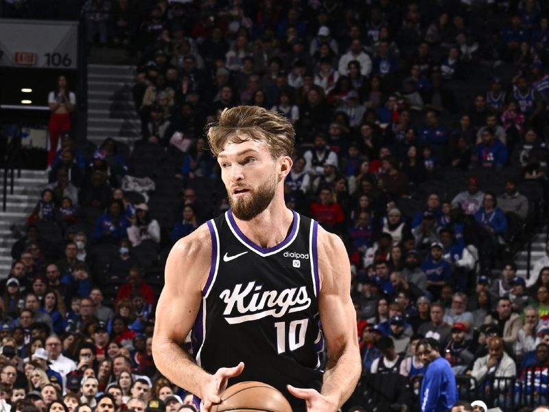 PHILADELPHIA, PA - JANUARY 12:  Domantas Sabonis #10 of the Sacramento Kings handles the ball during the game  on January 12, 2024 at the Wells Fargo Center in Philadelphia, Pennsylvania NOTE TO USER: User expressly acknowledges and agrees that, by downloading and/or using this Photograph, user is consenting to the terms and conditions of the Getty Images License Agreement. Mandatory Copyright Notice: Copyright 2024 NBAE (Photo by David Dow/NBAE via Getty Images)