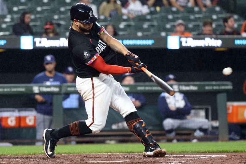 Jun 27, 2025; Baltimore, Maryland, USA; Baltimore Orioles catcher Gary Sanchez (99) hits a single during the third inning against the Tampa Bay Rays at Oriole Park at Camden Yards. Mandatory Credit: Daniel Kucin Jr.-Imagn Images