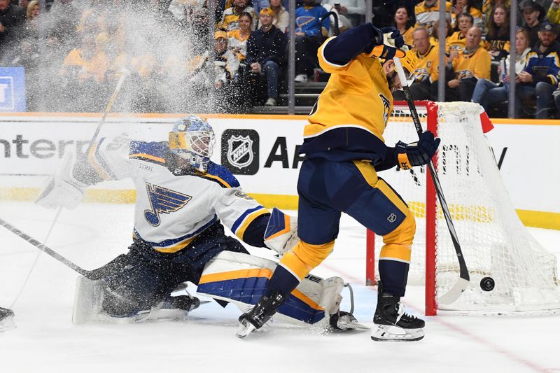 Apr 4, 2024; Nashville, Tennessee, USA; Nashville Predators left wing Jason Zucker (16) has a shot blocked by St. Louis Blues goaltender Jordan Binnington (50) during the first period at Bridgestone Arena. Mandatory Credit: Christopher Hanewinckel-USA TODAY Sports