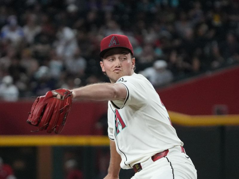 Apr 27, 2025; Phoenix, Arizona, USA; Arizona Diamondbacks pitcher Brandon Pfaadt (32) throws against the Atlanta Braves in the first inning at Chase Field. Mandatory Credit: Rick Scuteri-Imagn Images