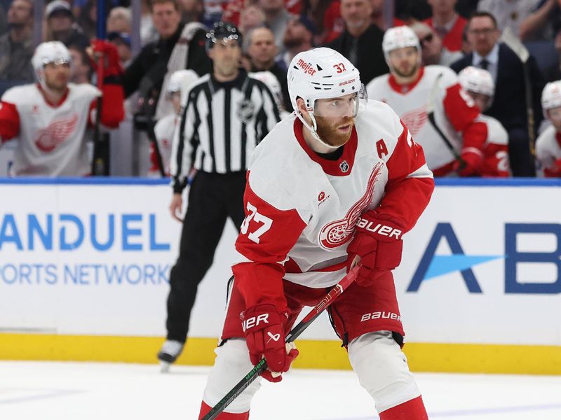 Apr 11, 2025; Tampa, Florida, USA;Detroit Red Wings left wing J.T. Compher (37) plays the puck during overtime against the Tampa Bay Lighting at Amalie Arena. Mandatory Credit: Kim Klement Neitzel-Imagn Images