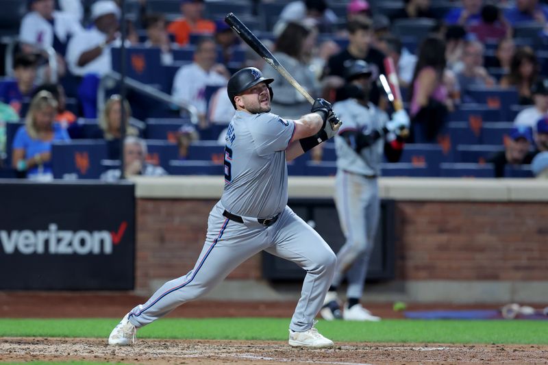 Jun 13, 2024; New York City, New York, USA; Miami Marlins third baseman Jake Burger (36) follows through on a solo home run against the New York Mets during the sixth inning at Citi Field. Mandatory Credit: Brad Penner-USA TODAY Sports