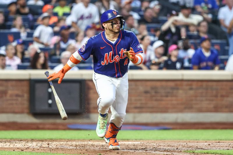 Jun 26, 2024; New York City, New York, USA;  New York Mets catcher Francisco Alvarez (4) hits a two run home run in the third inning against the New York Yankees at Citi Field. Mandatory Credit: Wendell Cruz-USA TODAY Sports