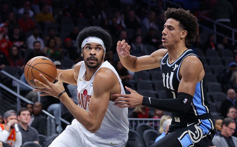 ATLANTA, GEORGIA - MARCH 06:  Jarrett Allen #31 of the Cleveland Cavaliers drives against Jalen Johnson #1 of the Atlanta Hawks during the first quarter at State Farm Arena on March 06, 2024 in Atlanta, Georgia.  NOTE TO USER: User expressly acknowledges and agrees that, by downloading and/or using this photograph, user is consenting to the terms and conditions of the Getty Images License Agreement.  (Photo by Kevin C. Cox/Getty Images)