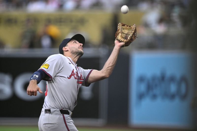 Jul 12, 2024; San Diego, California, USA; Atlanta Braves first baseman Matt Olson (28) catches a pop-up in foul territory hit by San Diego Padres second baseman Xander Bogaerts (not pictured) during the fourth inning at Petco Park. Mandatory Credit: Orlando Ramirez-USA TODAY Sports 