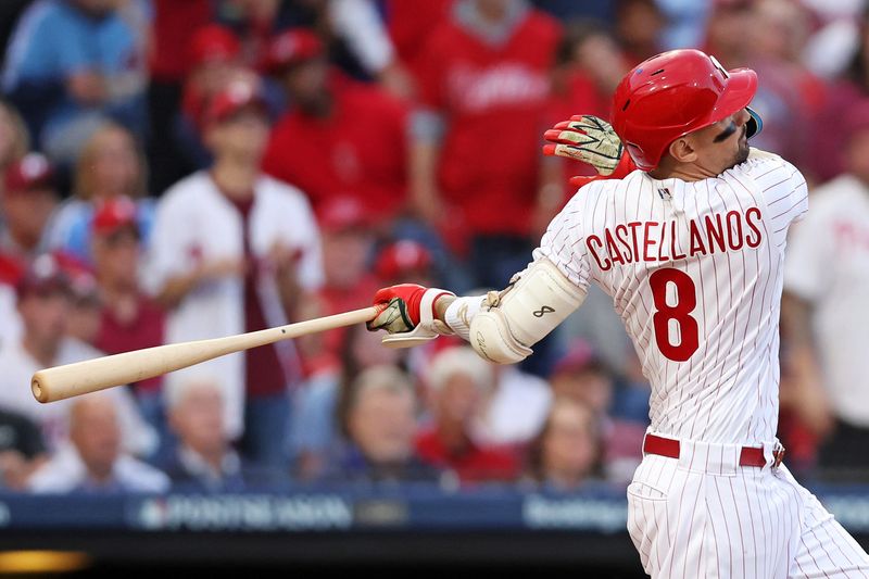 Oct 11, 2023; Philadelphia, Pennsylvania, USA;  Philadelphia Phillies right fielder Nick Castellanos (8) hits a solo home run during the third inning against the Atlanta Braves in game three of the NLDS for the 2023 MLB playoffs at Citizens Bank Park. Mandatory Credit: Bill Streicher-USA TODAY Sports