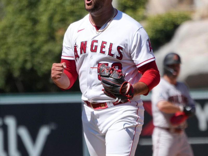 Jul 2, 2023; Anaheim, California, USA; Los Angeles Angels relief pitcher Carlos Estevez (53) celebrates at the end of the game against the Arizona Diamondbacks at Angel Stadium. Mandatory Credit: Kirby Lee-USA TODAY Sports
