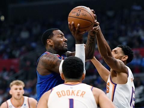 LOS ANGELES, CA - OCTOBER 23: John Wall #11 of the Los Angeles Clippers is fouled by Mikal Bridges #25 of the Phoenix Suns during the first half at Crypto.com Arena on October 23, 2022 in Los Angeles, California. NOTE TO USER: User expressly acknowledges and agrees that, by downloading and or using this photograph, User is consenting to the terms and conditions of the Getty Images License Agreement. (Photo by Kevork Djansezian/Getty Images)