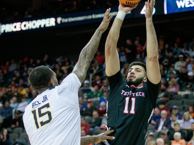 Mar 8, 2023; Kansas City, MO, USA; Texas Tech Red Raiders forward Fardaws Aimaq (11) puts up a shot over West Virginia Mountaineers forward Jimmy Bell Jr. (15) during the second half at T-Mobile Center. Mandatory Credit: William Purnell-USA TODAY Sports