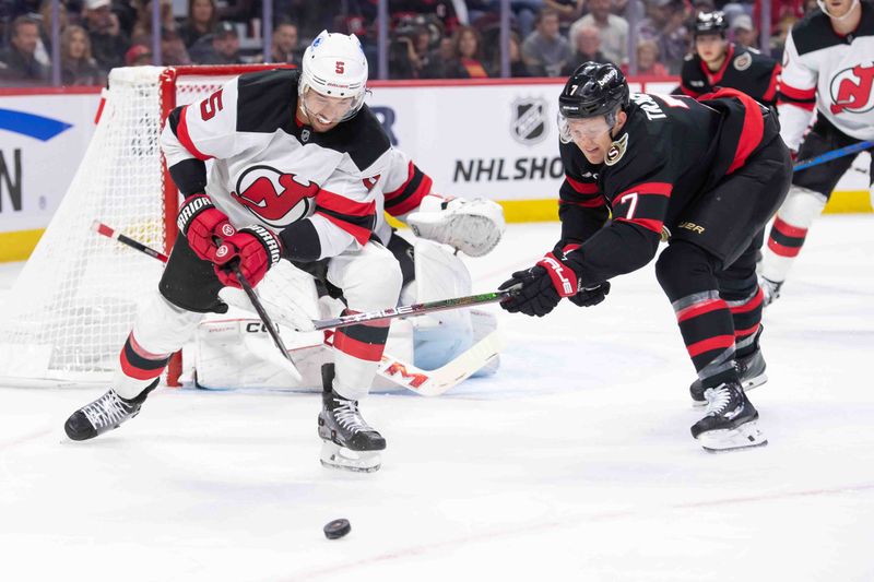 Oct 17, 2024; Ottawa, Ontario, CAN; New Jersey Devils defenseman Brendan Dillon (5) battles with Ottawa Senators left wing Brady Tkachuk (7) for control of the puck in the first period at the Canadian Tire Centre. Mandatory Credit: Marc DesRosiers-Imagn Images