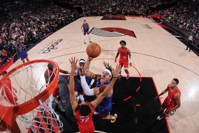 PORTLAND, OR - MARCH 23: Aaron Gordon #50 of the Denver Nuggets drives to the basket during the game against the Portland Trail Blazers on March 23, 2024 at the Moda Center Arena in Portland, Oregon. NOTE TO USER: User expressly acknowledges and agrees that, by downloading and or using this photograph, user is consenting to the terms and conditions of the Getty Images License Agreement. Mandatory Copyright Notice: Copyright 2024 NBAE (Photo by Cameron Browne/NBAE via Getty Images)