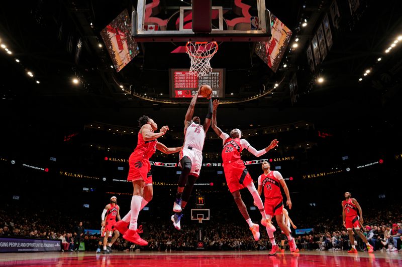 TORONTO, CANADA - JANUARY 17:  Bam Adebayo #13 of the Miami Heat drives to the basket during the game against the Toronto Raptors on January 17, 2024 at the Scotiabank Arena in Toronto, Ontario, Canada.  NOTE TO USER: User expressly acknowledges and agrees that, by downloading and or using this Photograph, user is consenting to the terms and conditions of the Getty Images License Agreement.  Mandatory Copyright Notice: Copyright 2024 NBAE (Photo by Mark Blinch/NBAE via Getty Images)