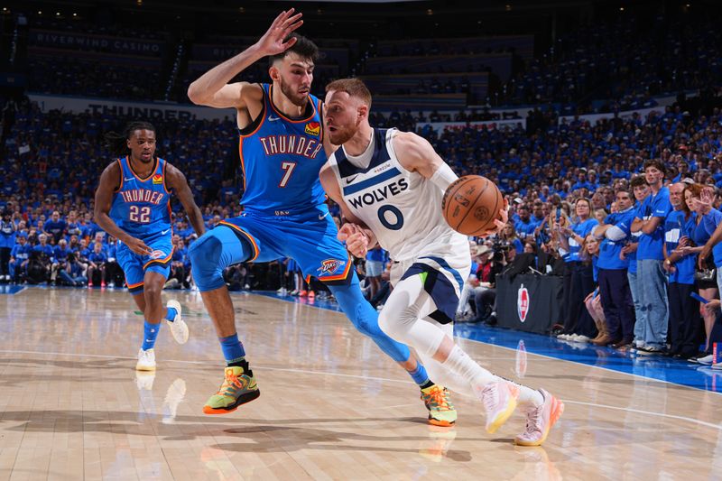 OKLAHOMA CITY, OK - MAY 22:  Donte DiVincenzo #0 of the Minnesota Timberwolves dribbles the ball during the game against the Oklahoma City Thunder  during Game 2 of the Western Conference Finals  on May 22, 2025 at Paycom Center in Oklahoma City, Oklahoma. NOTE TO USER: User expressly acknowledges and agrees that, by downloading and or using this photograph, User is consenting to the terms and conditions of the Getty Images License Agreement. Mandatory Copyright Notice: Copyright 2025 NBAE (Photo by Garrett Ellwood/NBAE via Getty Images)