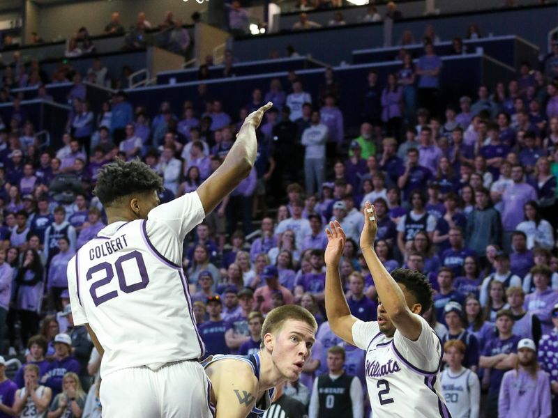 Feb 24, 2024; Manhattan, Kansas, USA; Brigham Young Cougars forward Noah Waterman (0) looks for room to move against Kansas State Wildcats forward Jerrell Colbert (20) and guard guard Tylor Perry (2) during the second half at Bramlage Coliseum. Mandatory Credit: Scott Sewell-USA TODAY Sports