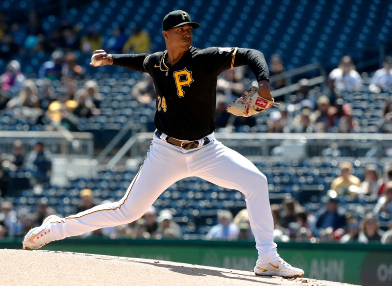 Apr 9, 2023; Pittsburgh, Pennsylvania, USA;  Pittsburgh Pirates relief pitcher Johan Oviedo (24) delivers a pitch against the Chicago White Sox during the first inning at PNC Park. Mandatory Credit: Charles LeClaire-USA TODAY Sports
