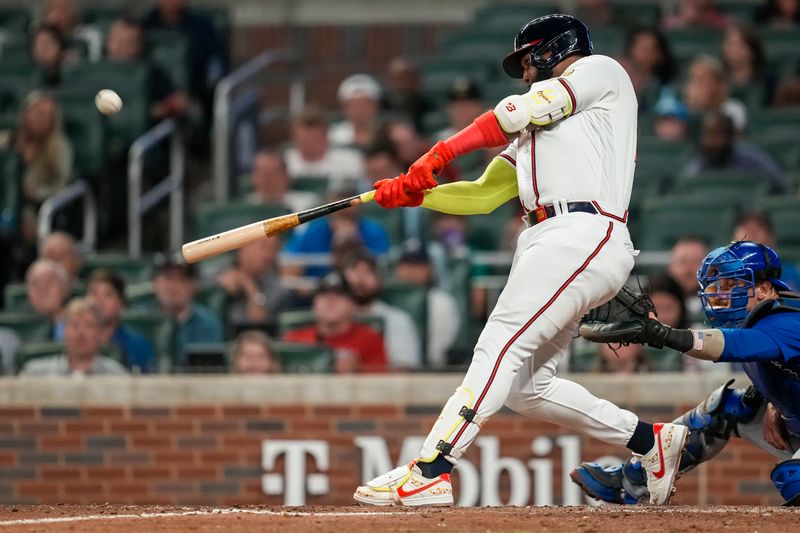 Sep 27, 2023; Cumberland, Georgia, USA; Atlanta Braves designated hitter Marcell Ozuna (20) hits a home run against the Chicago Cubs during the ninth inning at Truist Park. Mandatory Credit: Dale Zanine-USA TODAY Sports