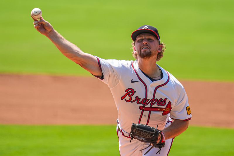 Jun 30, 2024; Cumberland, Georgia, USA; Atlanta Braves starting pitcher Spencer Schwellenbach (56) pitches against the Pittsburgh Pirates during the first inning at Truist Park. Mandatory Credit: Dale Zanine-USA TODAY Sports